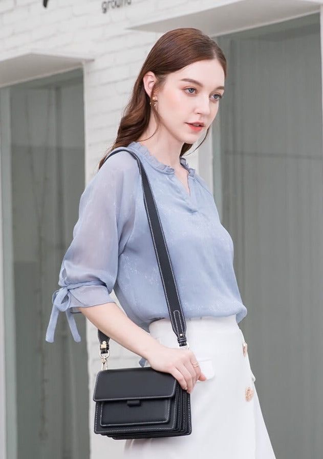 The Aella Crossbody Bag is the perfect blend of style and functionality for your on-the-go lifestyle. Crafted from high-quality vegan leather, it offers a compact yet spacious design for all your essentials.