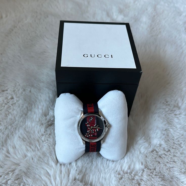 Never Been Used Authentic Gucci Watch With The Famous Snake Design, Battery May Need To Be Replaced, Comes With Box Red Watches With Diamond Hour Markers As Gift, Modern Gucci Watch For Gift, Gucci Analog Watch Gift, Gucci Analog Watch As Gift, Gucci Analog Watches As Gifts, Gucci Analog Watches For Gift, Gucci Watches With Diamond Hour Markers, Gucci Analog Watches As A Gift, Gucci Watches With Diamond Hour Markers As Gift