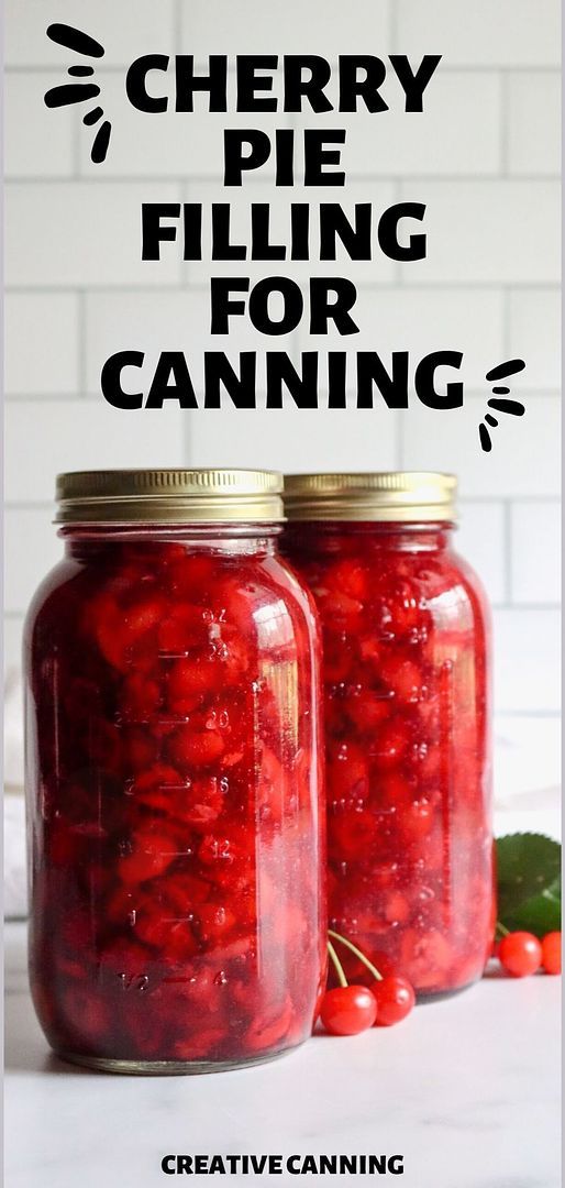 two jars filled with cherries sitting on top of a table