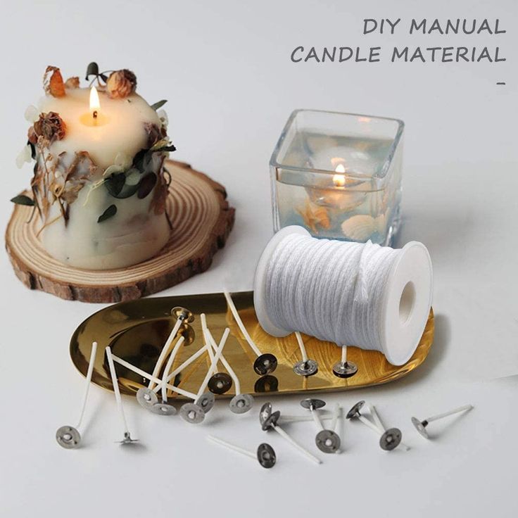 there is a candle and some pins on the table