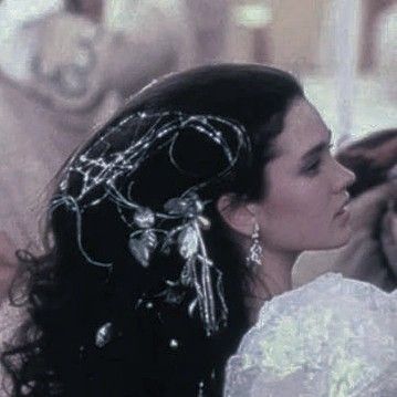 the bride and groom are kissing each other