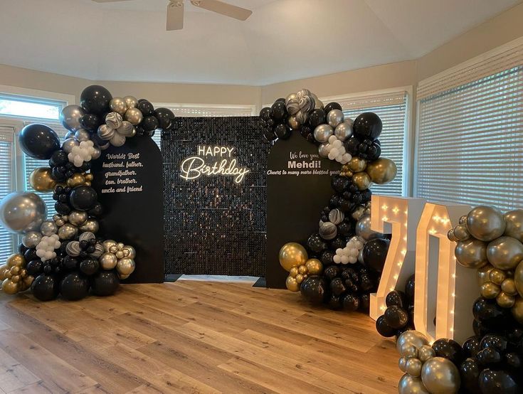 a birthday party with balloons and streamers in the shape of letters that spell out happy birthday