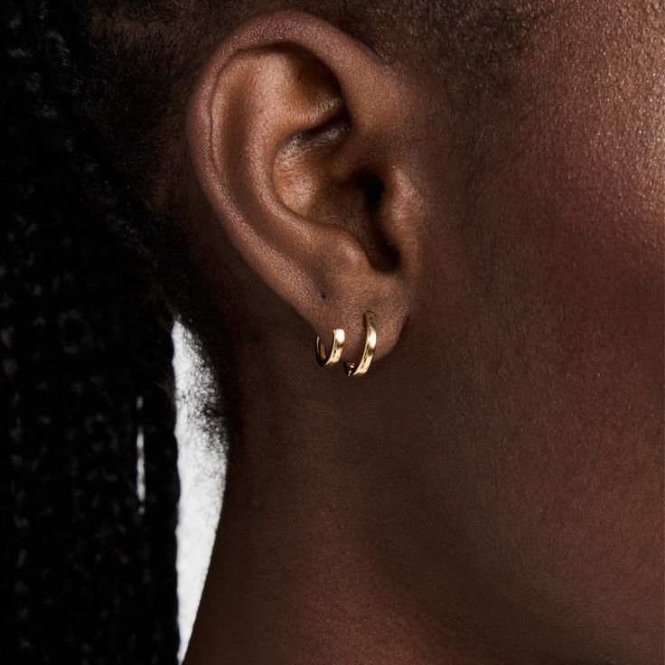 Katerina Double hoop earring, featuring the versatility of a two hole piercing, without the piercing. One larger hoop fits comfortably into a piercing, whilst the smaller accompanying hoop works as an adjustable ear cuff, sold as a pair. 18ct Vermeil Gold on Sterling Silver Measurement: Smaller hoop 0.39"(10mm) / Larger hoop 0.5"(13mm) Classic Pierced Ear Cuff, Everyday Pierced Ear Cuff, Dainty Wrap Earrings, Versatile Everyday Hoop Earrings, Yellow Gold Pierced Cartilage Earrings, Classic Everyday Ear Cuff, Gold Ear Cuff For Everyday, Gold Ear Cuff For Everyday Wear, Elegant Hoop Ear Wire Piercings