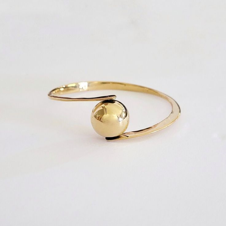 "Golden Pearl Bangle Handcrafted Solid Brass 2.5\" D X .5\" W" Adjustable Polished Gold-tone Jewelry, Gold-tone Round Brass Bracelets, Round Gold Bracelet Made Of Brass, Adjustable Tarnish Resistant Bangle, Stackable Yellow Gold Brass Bracelets, Adjustable Yellow Gold Round Cuff Bracelet, Adjustable Brass Bangle For Formal Occasions, Polished Yellow Gold Brass Bangle, Adjustable Brass Bracelets For Formal Occasions