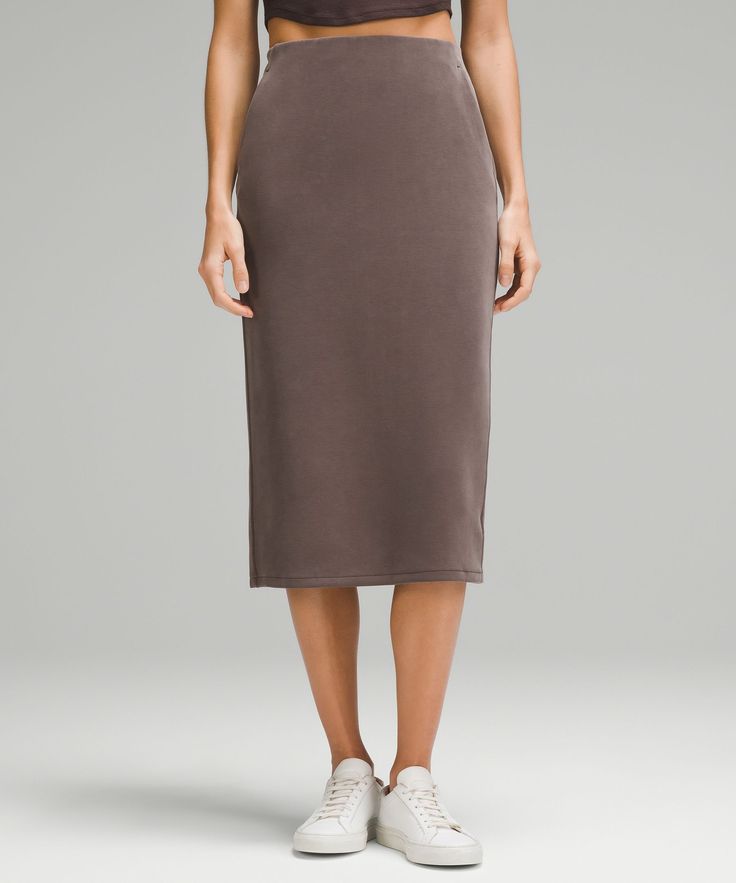 Feel it to believe it. From running errands to relaxed nights in, this lounge-worthy midi skirt dials up the softness. Designed for Casual. Hits below the knee to just above the ankle:Slim fit skims your body. Hand pockets with hidden card sleeve. Casual Pencil Skirt For Loungewear, Spring Midi-length Loungewear Bottoms, Spring Pencil Skirt For Loungewear, Relaxed Knee-length Skirt For Loungewear, Knee-length Relaxed Skirt For Loungewear, H&m Relaxed Fit Lined Skirt, Solid Non-stretch Midi Skirt, Relaxed Knee-length Viscose Skirt, Stretch Midi-length Lined Skirt