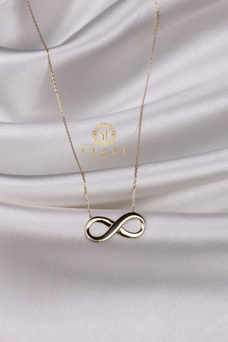 "ABOUT PRODUCT This 14K gold Infinity necklace is beautifully designed and hand crafted with our associates to make this a special gift for your loved ones. Knowing the value of our customers, We prepare each piece with extra care and attention. ITEM DETAILS Material: 14K Gold Approx: 2,85 gr Available colors: Gold, Rose Gold, White Gold Available Sizes: 14\" to 20\" ✪ 14k Solid Gold ( Certification will be included with your order ) ✪Available 14K White, Yellow, Rose Gold (also in 10, 18K) 🛠 Y Minimalist Infinity Necklace In White Gold, Anniversary Infinity Necklace With Delicate Chain, Minimalist Infinity Clavicle Chain Necklace, Minimalist White Gold Infinity Necklace, Minimalist Infinity Necklace With Delicate Chain, 14k Gold Infinity Jewelry For Formal Occasions, Formal Infinity Necklace With Adjustable Chain, Formal Infinity Clavicle Chain Jewelry, Formal 14k Gold Infinity Jewelry