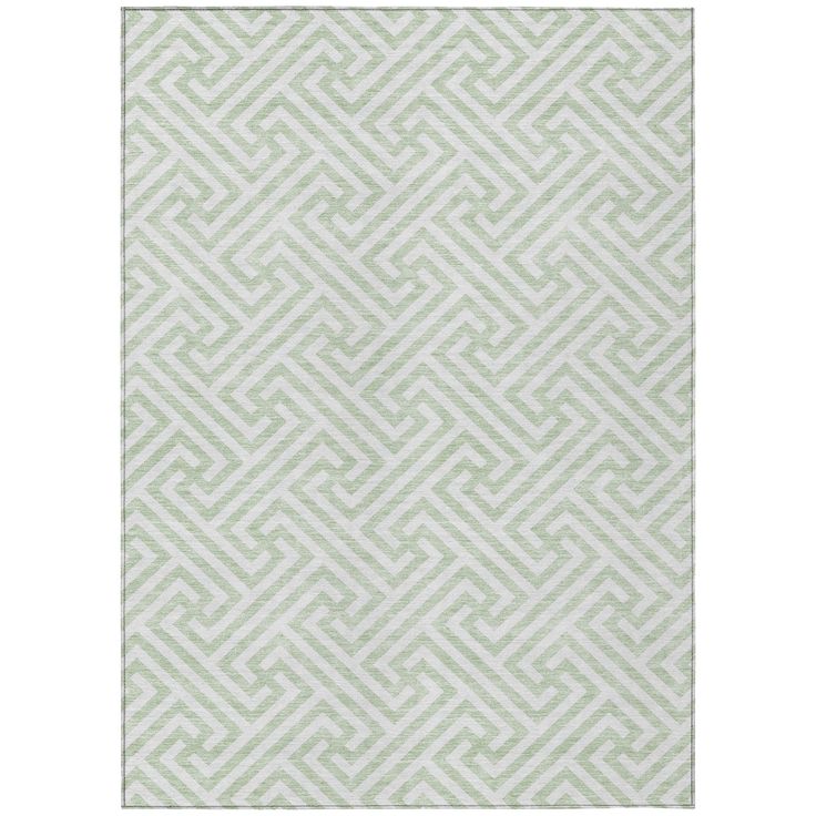 a green and white rug with an abstract design