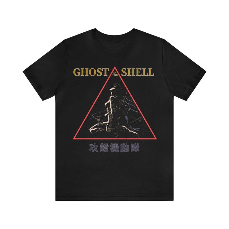 Introducing our unique Ghost in The Shell vintage t-shirt, a perfect addition to any manga and anime lover's wardrobe! This unisex retro graphic tee combines the timeless appeal of classic Japanese animation with a touch of nostalgia.  Printed on premium high quality Bella + Canvas soft t-shirts.  * Processing and Shipping Times - Please allow 3-5 business days for your order to be processed and made - Standard shipping takes 3-5 days - Please make sure your shipping address is correct before pl Pop Culture T-shirt With Letter Print For Cosplay, Fandom Graphic Print T-shirt For Streetwear, Pop Culture Graphic T-shirt For Cosplay, Pop Culture T-shirt With Graphic Print For Cosplay, Fandom Style T-shirt With Screen Print For Fan Gatherings, Cosplay Graphic Tee With Screen Print, Fandom T-shirt With Logo Print For Fans, Fandom Logo Print T-shirt For Fan Merchandise, Graphic Tee For Cosplay With Screen Print