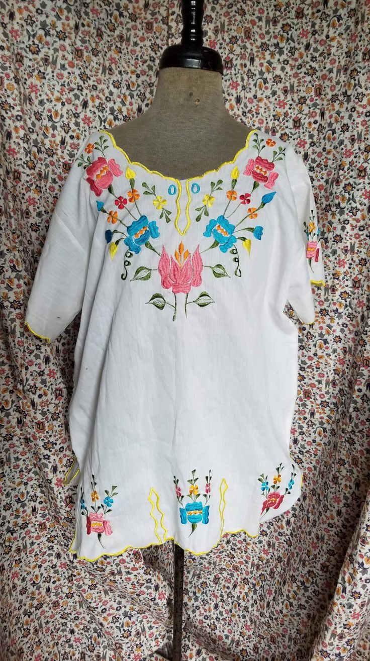 "Fantastic one of a kind looks to be hand made vintage floral embroidered scalloped edge top! No tag please pay close attention to the measurements Measurements are as follows: Shoulder to shoulder 17\" Chest 42\" length - 26\" Hip 42\" Sleeve length 6.5\" Feel free to make us an offer- don't be shy! International shipping please contact us prior to purchase" Fitted Short Sleeve Embroidered Top, Fitted Short Sleeve Top With Embroidered Hem, Spring Short Sleeve Blouse With Multicolor Embroidery, Floral Print Short Sleeve Embroidered Top For Spring, Multicolor Embroidered Short Sleeve Blouse For Spring, Retro Summer Tops With Floral Embroidery, Retro Floral Embroidered Summer Tops, Retro Short Sleeve Top With Floral Embroidery, Fitted Short Sleeve Blouse With Embroidered Hem