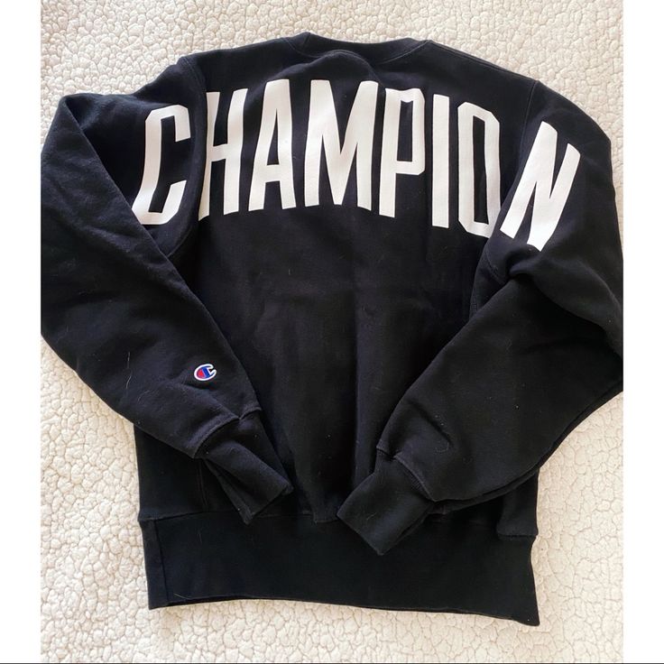 -Champion Black Crew Sweatshirt -Size Small, Fits Oversized Though -Never Worn, Perfect Condition (Hard To Photograph Black Sorry For The Fuzzies) -Champion Written On Back Black Top With Logo Lettering For Winter, Black Tops With Logo Lettering For Winter, Black Logo Lettering Top For Winter, Black Collegiate Tops With Lettering, Black Sporty Tops With Lettering, Sporty Black Tops With Lettering, Champion Sweatshirt, Black Sweater, Crew Sweatshirts