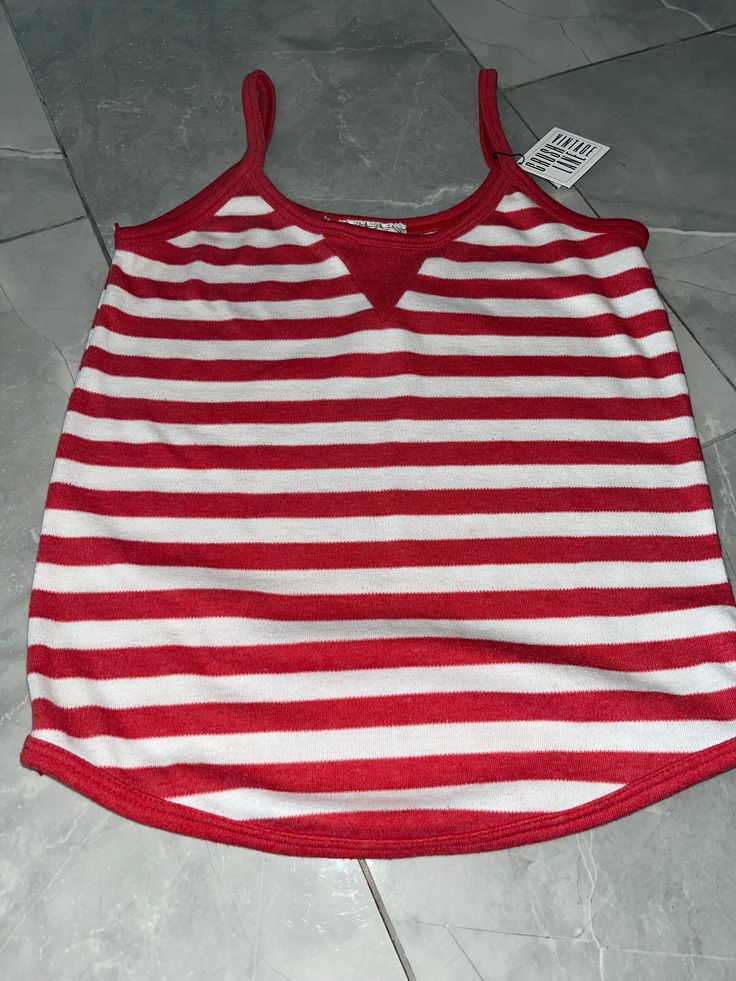 "Vintage red and white striped tank made by Clothes To You. 65% polyester, 35% cotton. Tagged as a medium, measures 13\" pit to pit, 20\" long." Casual White Tank Top With Contrast Stripes, Sleeveless Cotton Tank Top With Contrast Stripes, Cotton Sleeveless Tank Top With Contrast Stripes, Red Sporty Tank Top For Summer, Red Cotton Racerback Tops, Red Cotton Sporty Tank Top, White Sleeveless Tank Top With Contrast Stripes, White Sleeveless Top With Vertical Stripes, Red Cotton Tops With Tank Straps