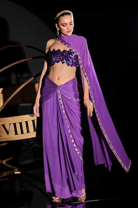 Purple pre-draped stitched saree with a knot on front, asymmetric pleated drape and placed sequin embellished border. Paired with a tube blouse with all over glass beads embellishment. - Aza Fashions Tube Blouse, Beads Embellishment, Stitched Saree, Drape Saree, Blouse For Women, Saree With Blouse, Aza Fashion, Knot, Types Of Sleeves