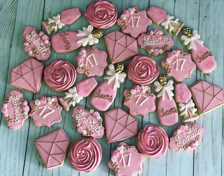 pink decorated cookies arranged in the shape of envelopes