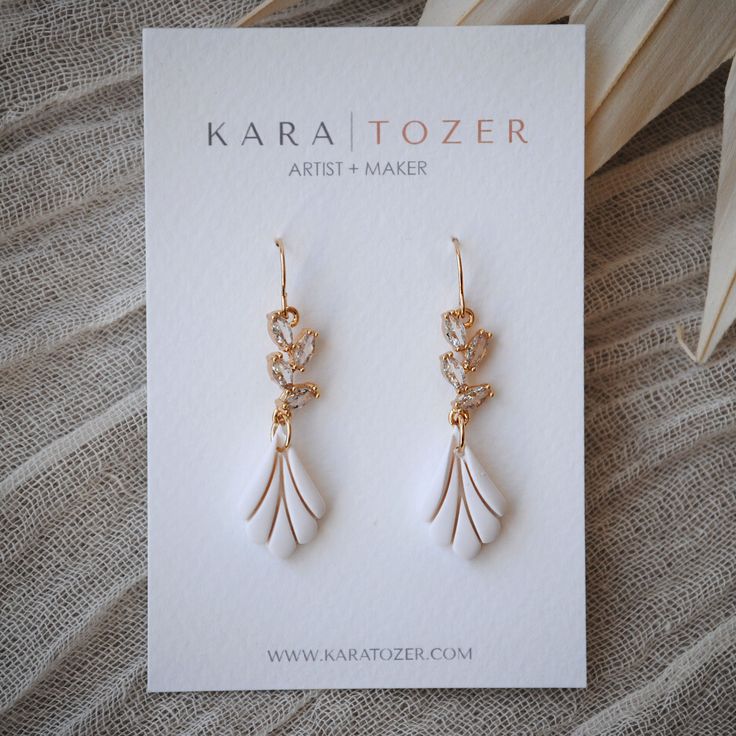 Our handmade scalloped bridal dangles are designed with marquis shaped CZ stones that descend into an elegant charm crafted from polymer clay. Hooks are made from high quality 14K gold filled material. One of our most loved styles for brides.  KARA | TOZER offers handmade clay and gold jewelry for everyday and special occasions. All of our everyday styles are inspired by neutral tones that will pair beautifully with any outfit. Items are restocked weekly but feel free to send a message if a cert Clay Hooks, Bridal Earrings Statement, Bridal Statement Earrings, Bridal Outfit, Gold Bridal Earrings, York Pa, Cubic Zirconia Earrings, Jan 17, Wedding Jewelry Earrings