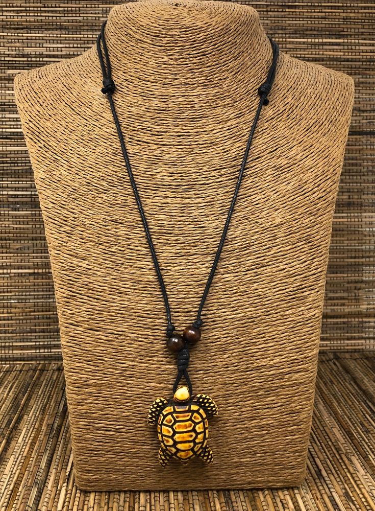 "Brown turtle necklace This Pendant Represent the Sea Turtles that lives in the clear Caribbean waters. This unisex necklace can be used short or long : you can adjust the cord from 16\" inches up to 32\" Inches around the neck. Adjustable cord with sliding knots Turtle Dimensions: 1.5\" Inches x 1.25\" Inches FAST SHIPPING. Visit my Etsy Shop to see more Designs! Turtle Earrings, Turtle Bracelets and Turtle Necklaces Click here https://www.etsy.com/shop/FreedomLifeStyle to see more designs" Brown Amulet Necklace With Round Pendant, Brown Amulet Style Necklace With Round Pendant, Brown Amulet Style Round Pendant Necklace, Brown Pendant Jewelry For Beach, Brown Pendant Jewelry For The Beach, Brown Beach Necklace With Adjustable Cord, Black Spiritual Necklace For Beach, Beach Amulet Pendant Necklace, Spiritual Pendant Necklaces For Beach