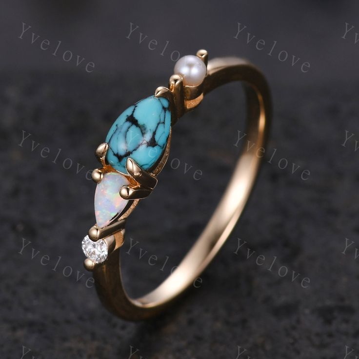 Vintage Turquoise Opal Ring Engagement Ring,Pear Cut Gems,Art Deco Pearl Moissanite Wedding Band,4 Stone Unique Women Bridal Promise Ring Rose gold ring,Sterling Silver ITEM SPECIFICATIONS:  Material:Solid gold (10K 14k 18k rose gold,yellow gold,white gold available) Center Stone:6X4mm pear  cut natural Turquoise ring Side Stone:4X2.5 pear cut lab created opal  and 2mm round cut  Moissanite stones and natural pearl Band width:approx 1.8mm Setting:prong set Our Service: All sizes available,please feel free to contact me if you need another ring sizes. Craft Period:Because all of rings are handmade to orders,it takes about 13-15 business days to make (not include weekend) and 3-5 business days for arrival,thanks for your understanding. Rush Order:We offer rush order service,it takes about 7- Gold Multi-stone Turquoise Ring For Wedding, Turquoise Opal Wedding Ring, Opal Ring Engagement, Art Deco Pearl, White Gold Promise Ring, Engagement Ring Pear, Pear Cut Engagement Rings, Unique Women, Moissanite Wedding Band