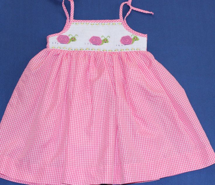 Hand smocked summer dress with embroidered snails. Ties at the shoulders. For custom orders allow 3-4 weeks for delivery. If you needed sooner; let me know. Cute Cotton Smocked Dress, Sleeveless Smocked Dress With Smocked Cuffs, Cute Cotton Smocked Dress With Smocked Cuffs, Cute Sleeveless Dress With Smocked Cuffs, Cute Summer Sundress With Smocked Bodice, Pink Cotton Sundress With Smocked Back, Cute Beach Sundress With Smocked Bodice, Summer Cotton Smocked Dress With Smocked Cuffs, Cute Smocked Summer Dress With Smocked Cuffs