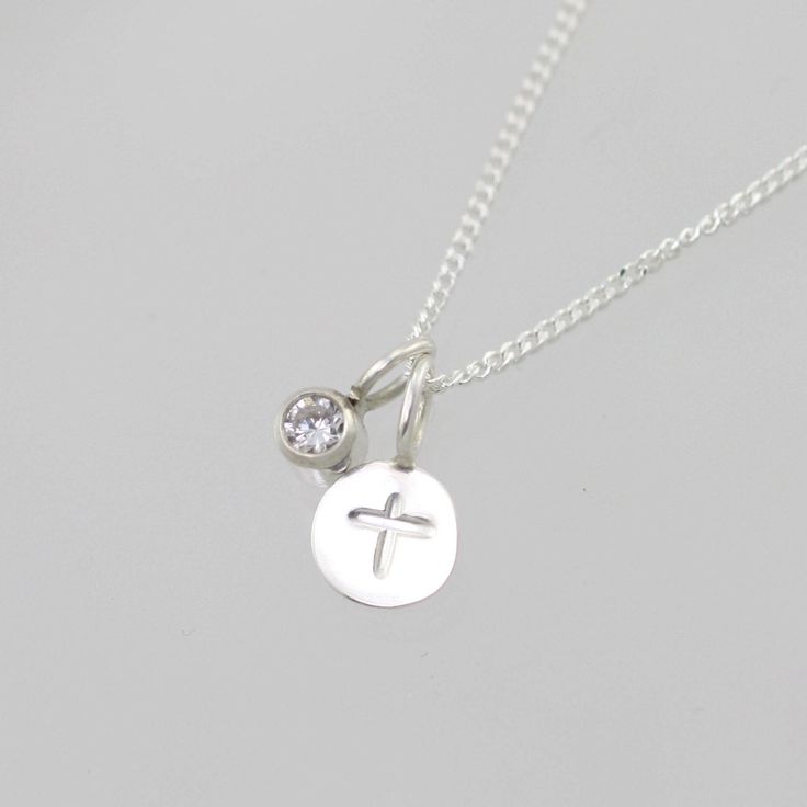 "Handcrafted sterling silver necklace with a stamped cross. Comes on your choice of a 16 or 18 inch sterling silver chain with the artist's tag attached at the clasp. (Shown on a 16\" chain) Makes an excellent gift. Can be worn a number of ways. Add more some birthstone drops for a more personal touch! To add a birthstone drop pendant, go to: https://www.etsy.com/listing/127617405/birthstone-drop-pendant-sterling-silver?ga_search_query=birthstone+drop+pendant&ref=shop_items_search_3" Inspirational Sterling Silver Nickel-free Charm Necklaces, Inspirational Sterling Silver Nickel-free Charm Necklace, Cross Necklace With Charms As Gift, Sterling Silver Cross Pendant Necklace With Charms, Sterling Silver Necklaces With Cross Pendant Charms, Dainty Sterling Silver Cross Pendant Charm Necklace, Spiritual Sterling Silver Hand Stamped Necklaces, Sterling Silver Charm Necklace With Cross Pendant, Sterling Silver Cross Charm Necklace