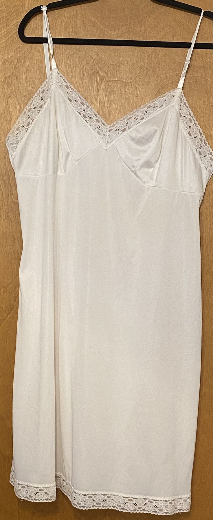 Vintage Vanity Fair made in USA full slip size 42 (XL) Nylon with lace trim 19" underarm to underarm  44" waist 42" overall length White Spaghetti Strap Nightgown With Lace Trim, White Nightgown With Lace Trim And Spaghetti Straps, Lace Camisole Slip Dress Bias Cut, Lace Camisole Slip Dress With Lace Bodice, White Sleeveless Slip Dress With Delicate Lace, White Sheer Slip Dress For Sleep, Fitted Sheer White Nightgown, White Slip Dress With Lace Bodice, Sleeveless, White Sheer Fitted Nightgown