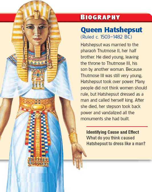 an egyptian woman with her hands in her pockets and headdress, is shown