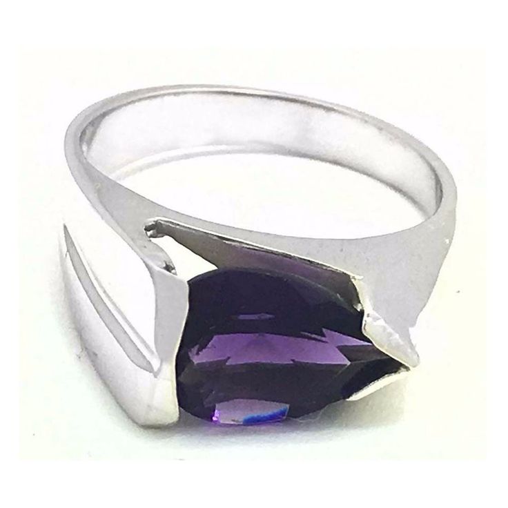 Carat: 14k White Gold (Not Plated) Gemstones: 1 Genuine Amethyst - 1.78 Carats Amethyst Grades, Hue . . . Violet/Purple Tone . . . Medium Saturation . . . Vivid No Inclusions Or Flaws Shape: Pear Net Weight: 4 Grams Type Of Setting: Prong Dimensions: 10 Mm X 7 Mm - Amethyst Measurements Finger Size: 6 (Free Resizing Service To Any Finger Size - If Needed) Modern Formal Gemstones With Polished Finish, Modern Amethyst Ring As Gift, Polished Amethyst Gemstones For Formal Occasions, Formal Polished Amethyst Gemstones, Modern Sterling Silver Amethyst Ring With Polished Finish, Modern Sterling Silver Amethyst Ring, Modern Polished Amethyst Ring, Modern Purple Amethyst Ring With Polished Finish, Modern Purple Rings With Polished Finish