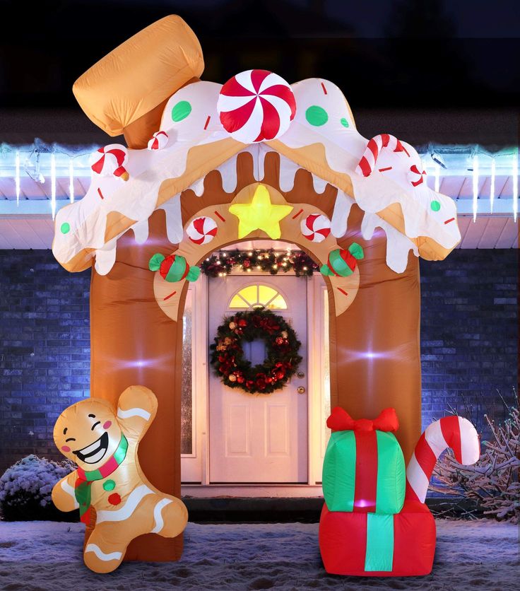 an inflatable gingerbread house is decorated for christmas