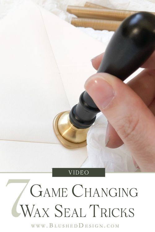 a person holding a black object in their hand with the title video game changing wax seal tricks