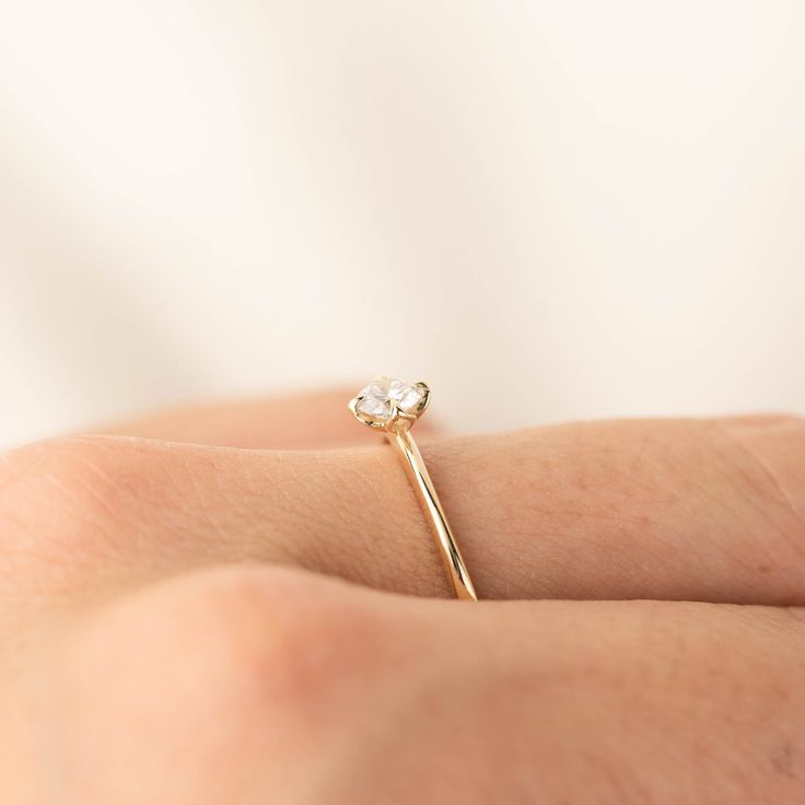 0.25ct brilliant cut diamond, 4mm, near colorless, eye clean 0.50ct GIA certified Excellent cut grade G color SI1 clarity (Made to order) Band width: approx. 1.1mm to 1.4mm tapered band High profile four prongs flower setting Made of 100% recycled solid 14k yellow gold and ethically sourced gemstone Alice ring is minimal and dainty, features 0.25ct brilliant cut diamond in our signature flower setting. The tapered band adds elegance to this unique engagement ring. The diamond size and quality ca Delicate Diamond Ring With Round Band, Minimalist White Diamond Ring With Single Cut Diamonds, Delicate Diamond Ring With Single Cut Diamonds, White Minimalist Diamond Ring With Single Cut Diamonds, Dainty Round Band Diamond Ring With Single Cut Diamonds, Delicate Promise Ring With Single Cut Diamonds, Delicate White Solitaire Diamond Ring, Wedding Stackable Diamond Rings With Single Diamond, Delicate Diamond White Wedding Ring With Single Cut Diamonds