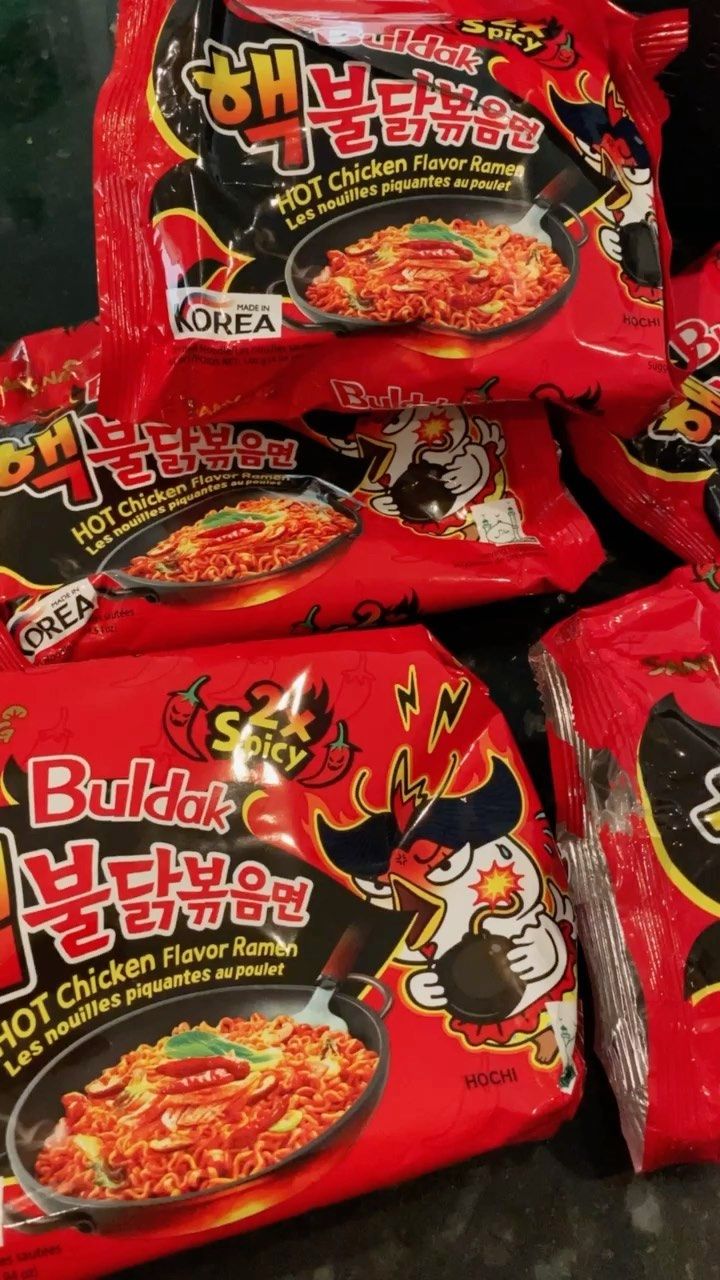 several bags of noodles are stacked on top of each other