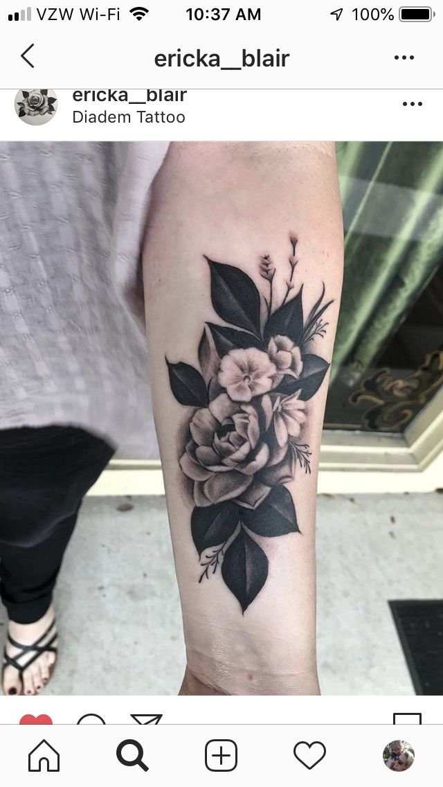 a woman's leg with a flower tattoo on it