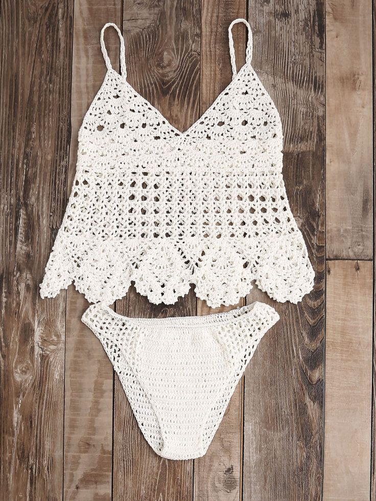 two pieces of white crochet swimsuit on wooden floor