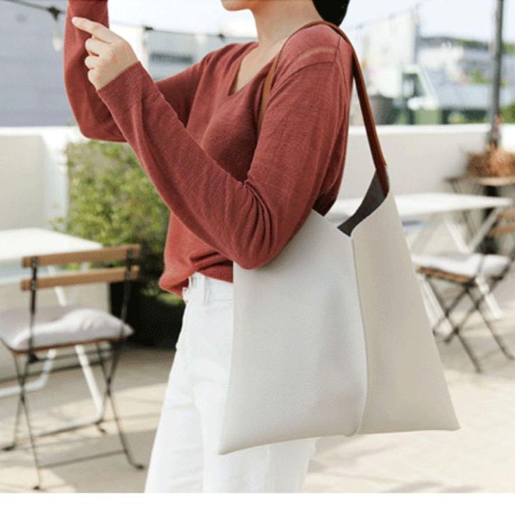 Overview： Design: Best Leather Tote Handbags Leather Tote Bag Women's Slouchy Leather Tote In Stock: 2-6 days to process orders Include: Only Shoulder Bag with Pouch Custom: None Color: White, Sky Blue, Army Green, Black Material: Cowhide Measures: 37cm x 39cm x 29cm x 50cm x 2.5cm Slots: 1 large slot, Pouch (1 large slot, 1 inner pocket slot, 1 inner zipped slot) Style: Genuine Leather vintage handmade tote bag shoulder bag Leather Shopper Tote Bag Description: The Minimalist Leather Tote is a sophisticated and stylish accessory designed to elevate any ensemble with its unique and fashionable design. This tote combines the timeless elegance of leather with a modern patchwork design, creating a piece that is both classic and contemporary. Its minimalist aesthetic is perfect for those who a Office Bags With Leather Handles In Pouch Shape, Office Pouch Bag With Leather Handles, Office Pouch Bags With Leather Handles, Office Shoulder Baguette Bag With Leather Handles, Office Pouch Shoulder Bag With Leather Handles, Office Shoulder Bag With Leather Handles, Leather-handled Baguette Shoulder Bag For Office, Bags With Leather Handles For Errands, Shopping Satchel Baguette Bag With Leather Handles