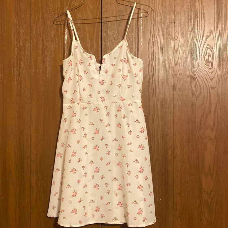 Rue 21 Mini Dress. Brand-New With Tags, White With Pink Floral Print. Size Medium. I Can Provide Measurements If Necessary. Selling For 14$ Obo Cute White V-neck Sundress, White V-neck Sundress Casual Style, White V-neck Casual Sundress, Casual White V-neck Sundress, White Lined Mini Dress For Daytime, White Lined Casual Sundress, Casual Lined Mini Dress For Daytime, White Mini Sundress For Date Night, White A-line Feminine Sundress