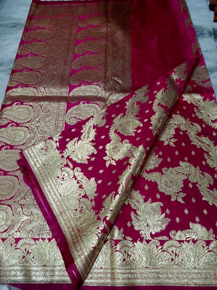 Heavy kataan Benarasi silk saree for wedding, woven with heavy gold zari thread. This rich saree is ideal for wedding wear, teams best with gold jewellery. Traditional wedding wear. Saree length is 5.5m with 0.8m blouse piece. Wedding Jamawar Pre-draped Saree With Zari Weaving, Semi-stitched Paithani Silk Saree For Wedding, Katan Silk Pre-draped Saree For Wedding And Diwali, Wedding Meenakari Katan Silk Pre-draped Saree, Semi-stitched Banarasi Silk Blouse Piece With Pallu, Banarasi Silk Pre-draped Saree With Zari Weaving, Gold Banarasi Silk Saree With Pallu, Traditional Katan Silk Wear With Meenakari For Festivals, Traditional Meenakari Katan Silk Wear For Festivals