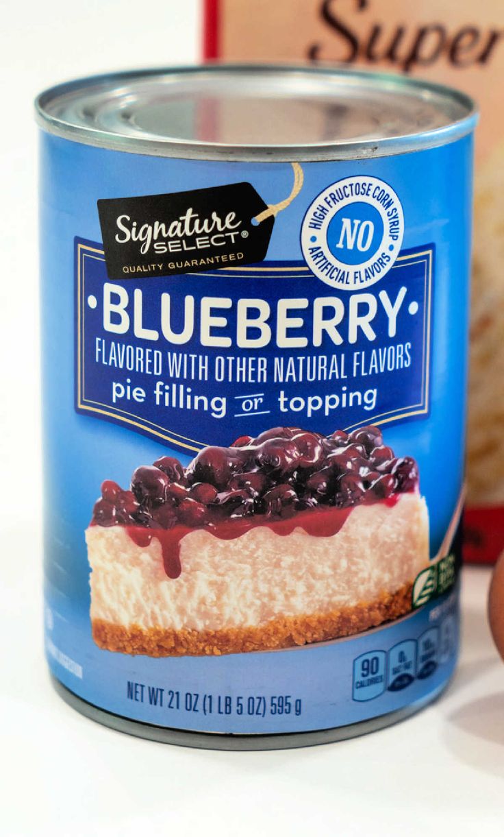 a can of blueberry pie filling next to an egg