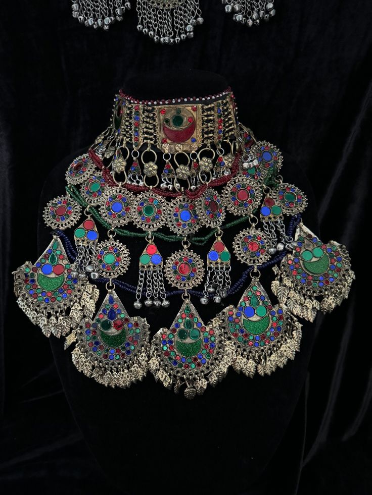 Exquisite Afghan Jewelry Set - Perfect for Special Occasions🇦🇫 Add a touch of exotic elegance to your look with our stunning Afghan jewelry set. Handcrafted by skilled artisans, each piece is a unique work of art that captures the rich cultural heritage of Afghanistan. This set includes a dazzling necklace, matching earrings, and a Tikka headpiece, all intricately designed with traditional Afghan motifs and embellished with vibrant Multicoloured gemstones. Balochi Doch Jewelry, Traditional Jewelry With Motifs For Navratri, Traditional Green Jewelry With Motifs, Adjustable Multicolor Ceremonial Jewelry, Adjustable Multicolor Jewelry For Ceremonial Occasion, Beaded Jewelry For Rituals And Festivals, Red Motifs Jewelry For Rituals, Red Motif Jewelry For Rituals, Traditional Multicolor Choker For Festival