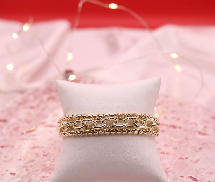 This bracelet is beautiful and can be worn for any occasion. It's a great addition to any jewelry collection. Elegant Metal Charm Bracelet With Box Chain, Elegant Charm Bracelet With Box Chain, Elegant Round Charm Bracelet With Box Chain, Elegant Jewelry With Adjustable Rectangular Chain, Elegant Metal Gold Bracelet With Box Chain, Elegant Rectangular Jewelry With Adjustable Chain, Elegant Gold Box Chain Bracelet, Trendy Wedding Bracelet Jewelry, Elegant Formal Paperclip Chain Bracelet