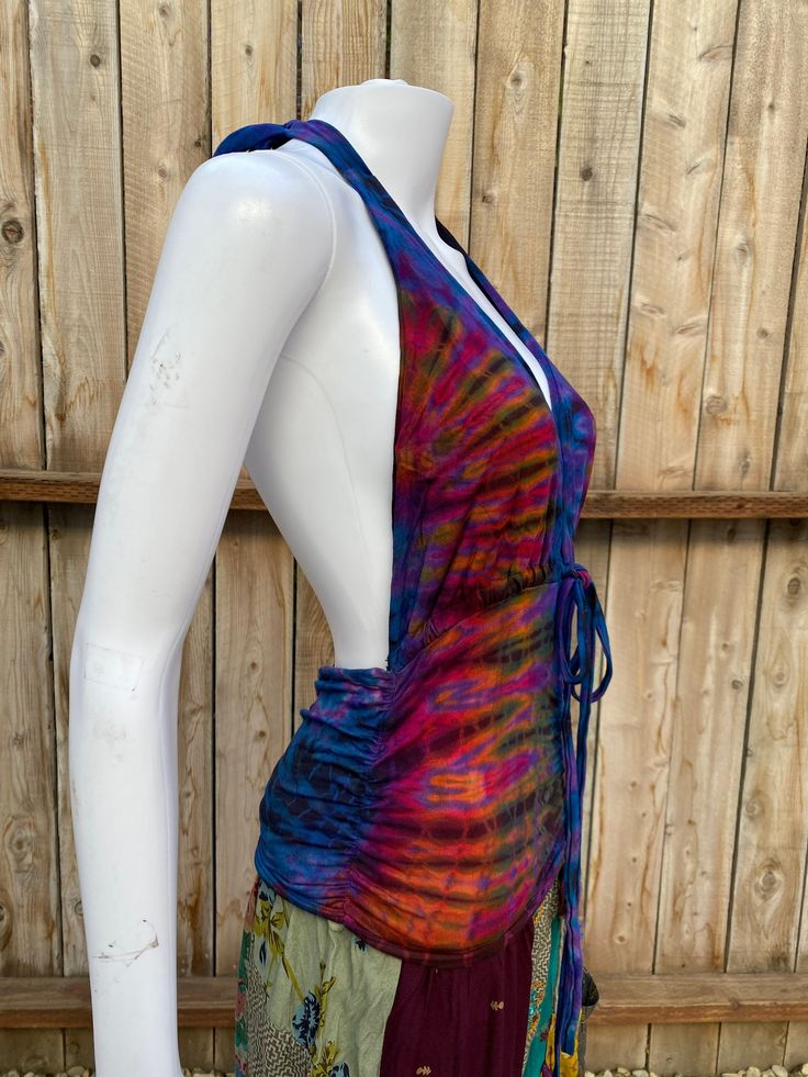 Multicolor Stretch Triangle Top, Bohemian Stretch Triangle Halter Top, Bohemian Triangle Halter Top With Stretch, Multicolor Triangle Top For Festival, Multicolor Halter Neck Top For Festivals, Hippie Stretch Tops For Beach, Hippie Stretch Tops For The Beach, Hippie Style Stretch Tops For Beach, Multicolor Triangle Halter Top For Festival