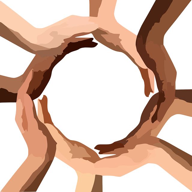 a group of people's hands in the shape of a circle on top of each other