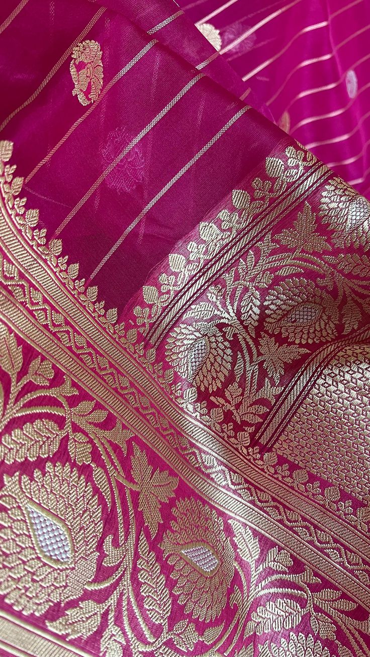 This saree uses Pure Organza Silk warp and weft. Kora silk has a very distinct crisp feel and drape. Their diaphanous/sheer nature makes the fabric breathe and the motifs to stand out. A preferred choice for summers. The saree features the Kadhuan Brocade weaving technique, considered to be the epitome of handloom brocade weaving, to create the motifs. Each buta is woven individually with a hand shuttle, diligently, one line at a time by a master weaver. Weaving time for each saree is usually in excess of 200 man hours, often significantly longer. The saree comes with an unstitched blouse piece and matching petticoat.Please refer to the last product image for a snapshot of the blouse piece. Useful Tip. To see the richeness of the weave and zari in a handwoven saree, we recommend you see th Luxury Brocade Dupatta With Zari Weaving, Silk Kora Dupatta, Traditional Drape Dupatta With Kora Details, Elegant Dupatta With Kora In Traditional Drape, Elegant Kora Dupatta In Traditional Drape, Elegant Chanderi Dupatta With Kora Details, Elegant Chanderi Dupatta With Kora, Festive Kora Dupatta, Elegant Festive Dupatta With Kora Detail