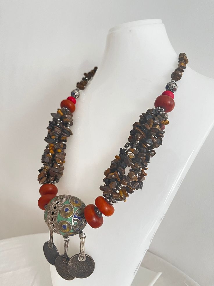 This necklace is a perfect gift for someone who truly loves and appreciates beautiful gemstones. I can only say that it is a beautiful piece of jewelry that will really make you stand out from the crowd. This necklace is made of huge beads. * Antique Moroccan Berber Necklace Handmade with coins, the necklace features an intricate pattern in its texture, a beautiful Berber piece of jewelry that radiates Moroccan Berber history and cultural significance, each handcrafted by artisans qualified from Bohemian Polished Beads For Jewelry Making, Bohemian Necklaces With Natural Stones, Bohemian Handmade Beaded Pendant Necklaces, Handmade Bohemian Beaded Pendant Necklaces, Bohemian Pendant Jewelry With Polished Beads, Bohemian Gemstone Jewelry For Festivals, Traditional Gemstone Beaded Round Pendant, Bohemian Brown Gemstone Necklace, Bohemian Agate Round Pendant Jewelry