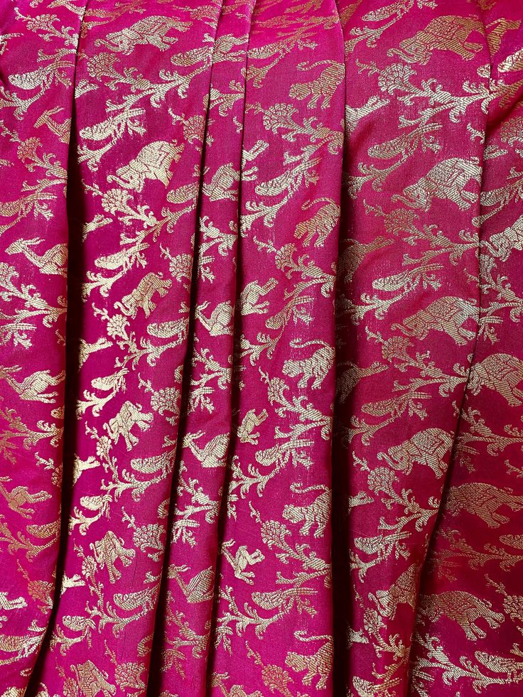 Gorgeous Purple Color Banarasi Silk Shikargah Saree in gold Zari Weave Work. Peacock, Elephant, Parrot, Lion, deer Motifs all over the body, borders and pallu of the saree. Item : Saree Base Fabric : Banarasi Silk Color : Magenta, Purple and Blue Blouse piece : Comes with un-stitched Blouse piece. Blouse material : Banarasi Silk Work : Handloom Fall & Edging(Yes/No) : Yes Disclaimer: Slight variation in actual color vs. image is possible due to the screen resolution. Kindly note : Since this Gold Anarkali Sherwani With Zari Work, Gold Semi-stitched Chanderi Sherwani, Gold Anarkali Sherwani Semi-stitched, Semi-stitched Gold Anarkali Set With Motifs, Gold Silk Bollywood Sherwani, Eid Festival Gold Sets With Motifs, Gold Jamawar Anarkali Set With Zari Work, Festive Gold Jamawar Lehenga, Gold Silk Sherwani For Festive Season