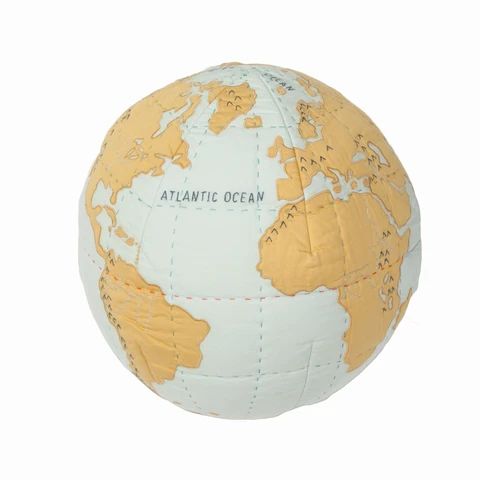 a white and gold globe with the words atlantic ocean on it's side, against a white background