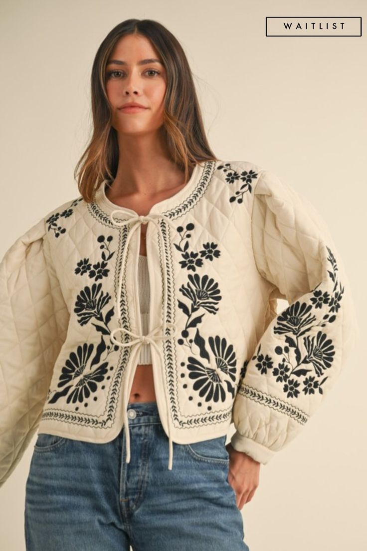 Introducing the Lena shacket, a playful twist on the classic quilted shacket. Adorned with stunning floral embroidery and tied in the front, this ivory jacket is sure to turn heads. Stay cozy and chic in this adorable piece. *THE ITEM IS ESTIMATED TO ARRIVE ON THE DATE ABOVE* Details + Fit 60% Rayon | 40% Polyester Runs True to Size Hand Wash Cold Hang Dry Round Neckline Long Sleeves Front Self Tie Quilted Floral Embroidered Design Ivory | Multi | Printed Model is 5'8" and wearing a size Small Embroidery Jackets For Women, Quilted Shacket, Tie Quilt, Embroidered Jacket, Short Pajama Set, Short Sleeved Sweaters, Stay Cozy, Embroidered Design, Quilted Jacket