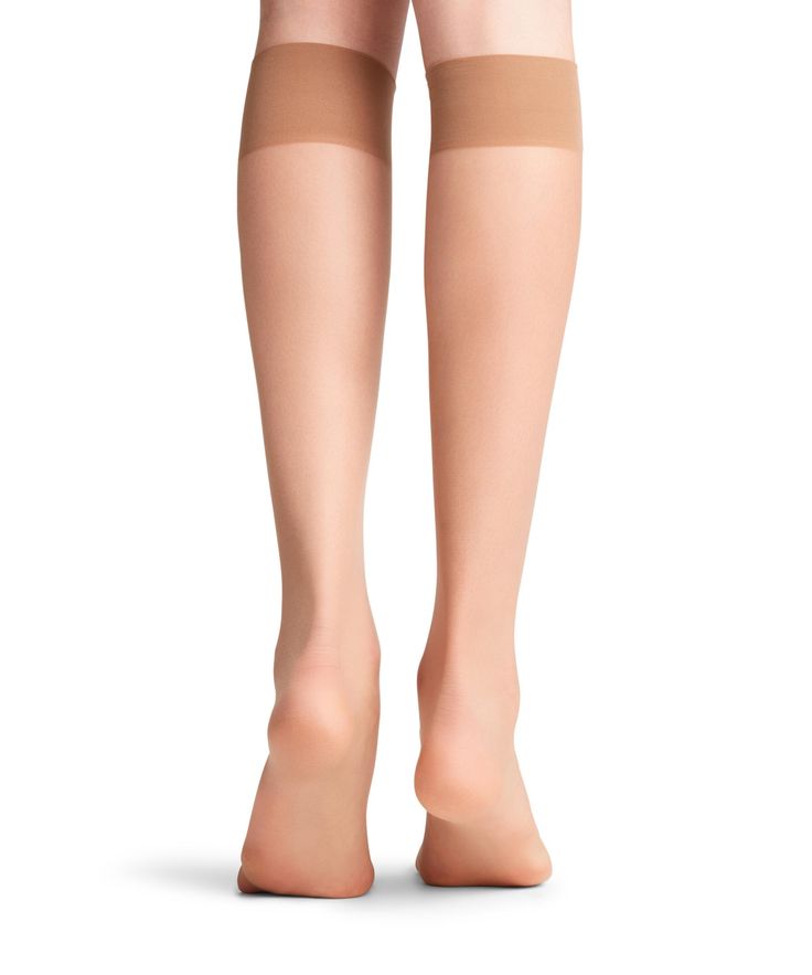 These elegant, sheer, fine knee-high socks with an even knit structure ensure a silky feel on the skin. The comfortable, sensitive cuffs and toes with the finest soft seams guarantee the highest level of comfort. Nylon Knee-high Socks, Elegant Compression Thigh High Stockings, Elegant Thigh High Compression Stockings, Elegant Thigh-high Compression Stockings, Elegant Full-length Solid Hosiery, Elegant Full Length Solid Legwear, Soft Knee-high Stockings, Elegant Mid-thigh Stretch Hosiery, Elegant Stretch Mid-thigh Length Hosiery