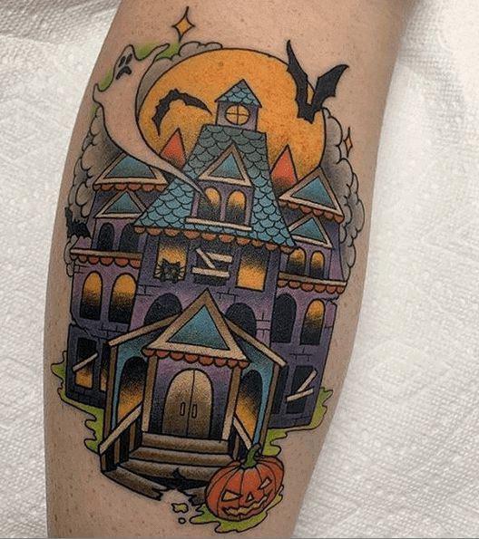 a halloween themed house with bats and pumpkins on the leg, done by person