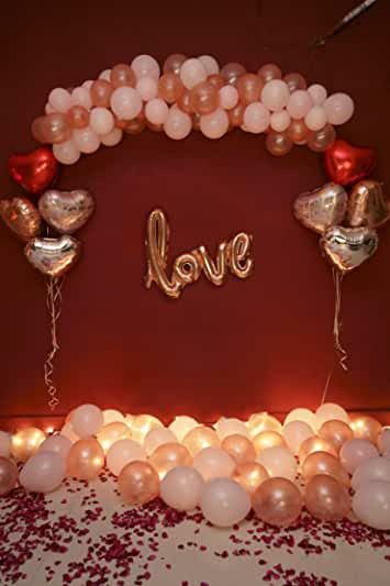 balloon arch with love letters and balloons