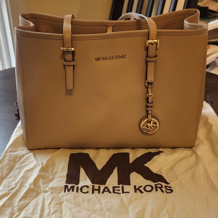 Gently Used. In Great Condition. Fits 13" Laptop. Includes Multiple Organization Pockets. Beautiful Anti-Scratch Leather That Is Very Durable. No Scratches Or Stains. Includes Original Storage Dust Bag. Michael Kors Tote Bag, Michael Kors Tote Bags, Bags Michael Kors, Tan Color, Womens Tote Bags, Dust Bag, Michael Kors, Laptop, Tote Bag