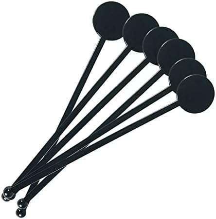 six round black plastic picks on a white background