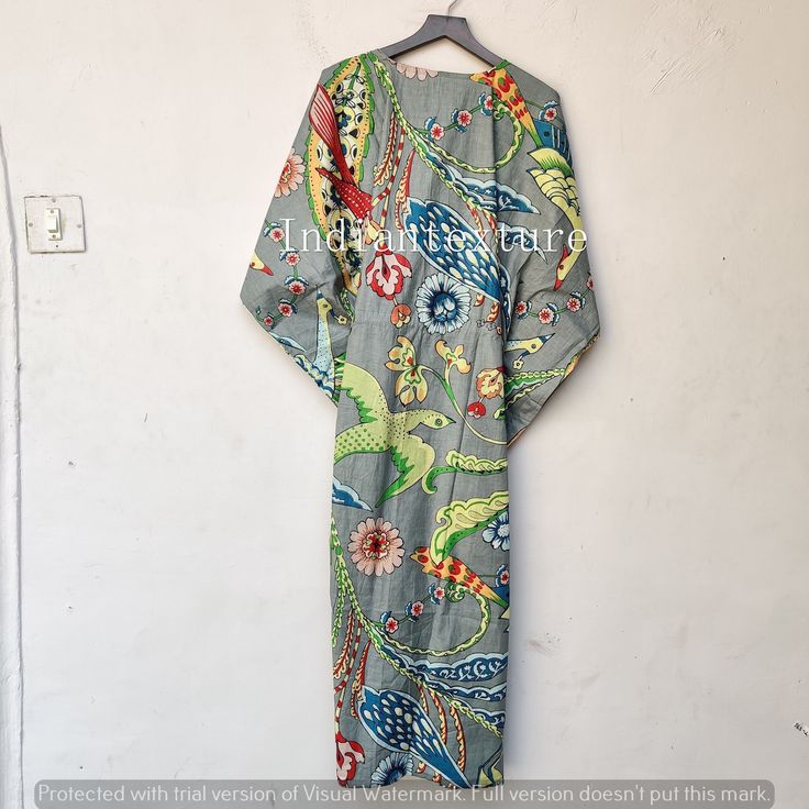 "This Beautiful Indian Cotton Caftan or can be called as Tunic is made with super fine quality cotton and designs have been crafted by Hand Prints. Measurements :- Size - Free Size Length -130 Cm /52\" Inches Bust/chest size - 120 CM/ 48\" Inches Fabric - 100% Cotton Pattern - Floral Kaftan has Adjustable Drawstring Waist to loose or tight , Kaftan has V Shape Neck Which is 8\" Inches Deep. Kaftan Is Multi-purposeand can be worn as a cover up at the Beach ,Loumge wear ,sleepwear ,Pregnant Women Patterned Long Kaftan For Beach, Long Patterned Kaftan For Beach, Patterned Long Beach Kaftan, Fitted Multicolor Kaftan With Kimono Sleeves, Fitted Bohemian Kaftan With Kimono Sleeves, Fitted Kimono With Kimono Sleeves For Vacation, Fitted Beach Kimono With Kimono Sleeves, Fitted Green Kimono For Summer, Fitted Long Sleeve Kaftan For Beach